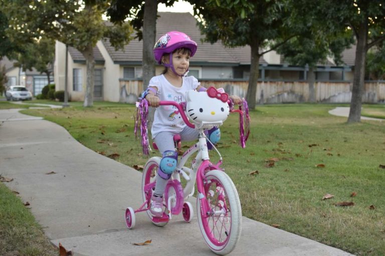 girl riding bike in new neighborhood Escondido